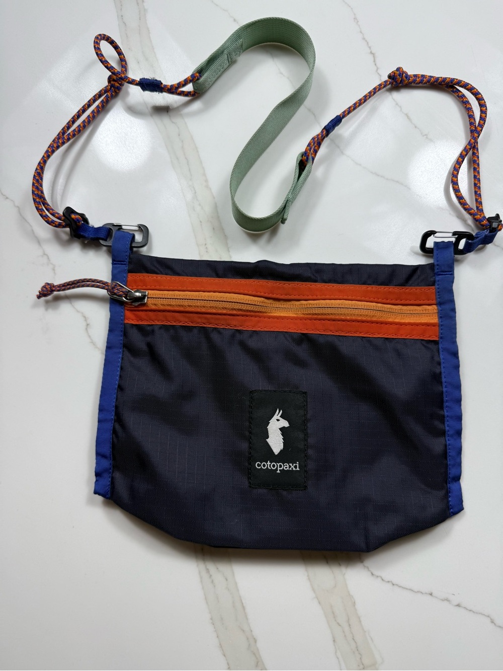 cotopaxi navy, orange & blue crossbody pouch